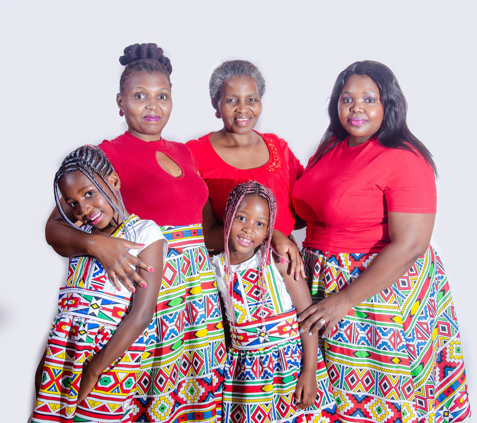 Multi generational African women and girls in national costumes